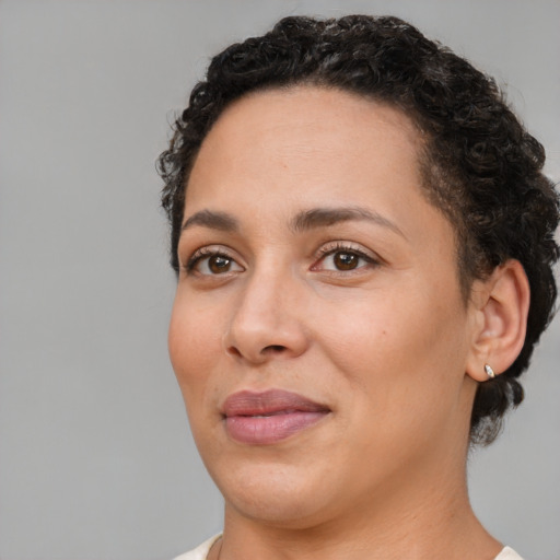 Joyful white adult female with short  brown hair and brown eyes