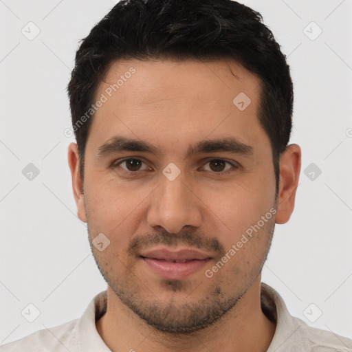 Joyful white young-adult male with short  black hair and brown eyes