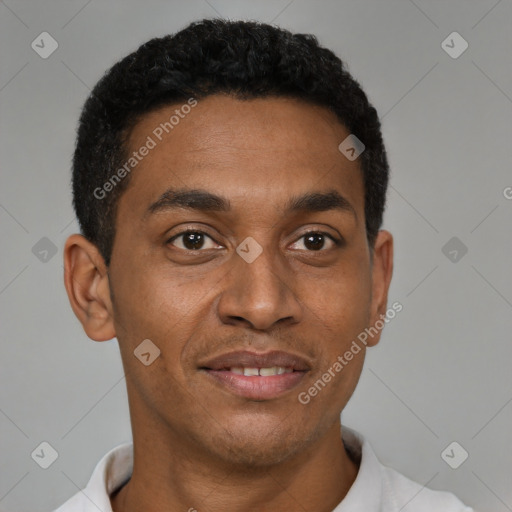 Joyful black young-adult male with short  black hair and brown eyes