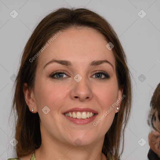 Joyful white young-adult female with medium  brown hair and blue eyes