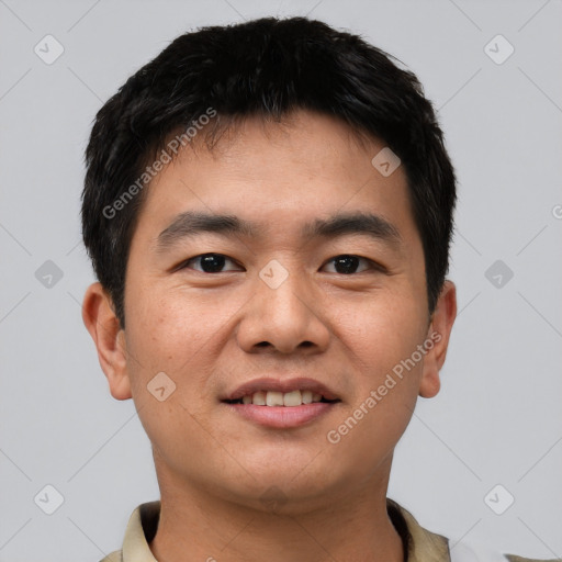 Joyful asian young-adult male with short  black hair and brown eyes