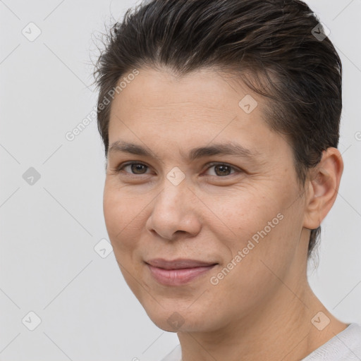 Joyful white adult female with short  brown hair and brown eyes