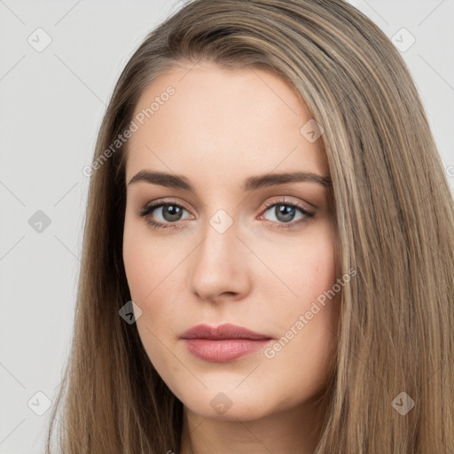 Neutral white young-adult female with long  brown hair and brown eyes