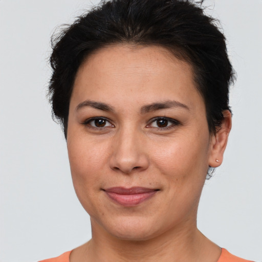 Joyful white adult female with short  brown hair and brown eyes