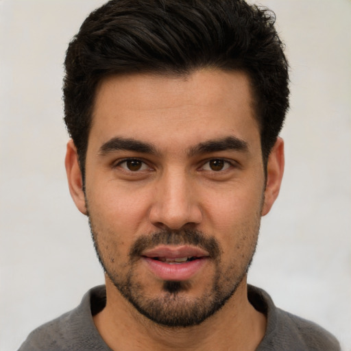 Neutral white young-adult male with short  black hair and brown eyes