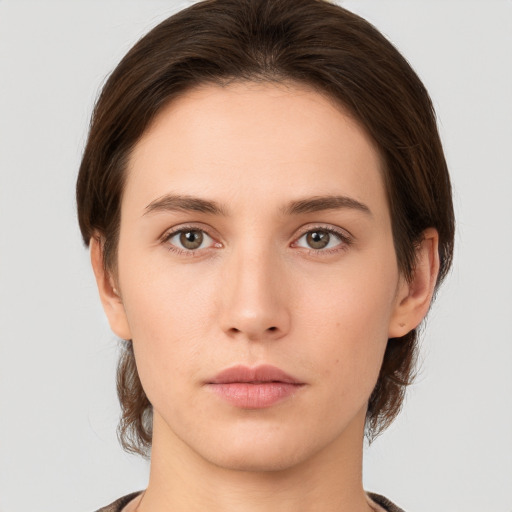 Neutral white young-adult female with medium  brown hair and brown eyes