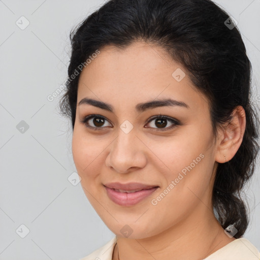 Joyful latino young-adult female with medium  brown hair and brown eyes