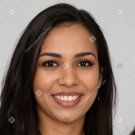 Joyful latino young-adult female with long  brown hair and brown eyes