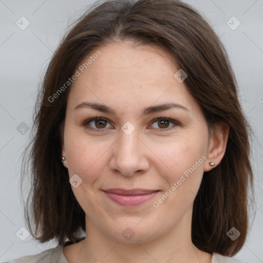 Joyful white adult female with medium  brown hair and grey eyes