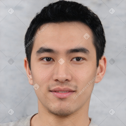 Joyful asian young-adult male with short  black hair and brown eyes