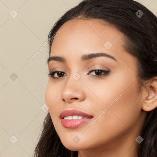 Joyful latino young-adult female with long  brown hair and brown eyes