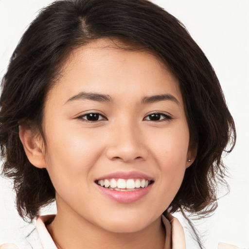 Joyful white young-adult female with medium  brown hair and brown eyes