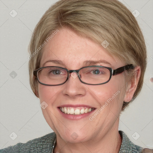 Joyful white adult female with medium  brown hair and blue eyes