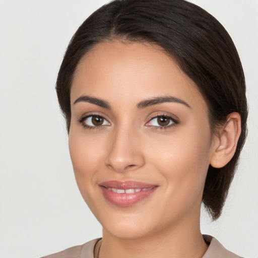 Joyful white young-adult female with medium  brown hair and brown eyes