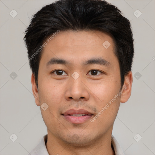 Joyful asian young-adult male with short  black hair and brown eyes