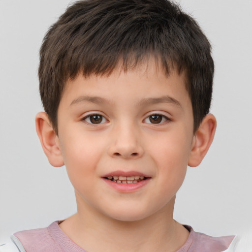 Joyful white child male with short  brown hair and brown eyes