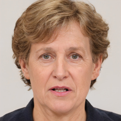 Joyful white middle-aged female with short  brown hair and brown eyes