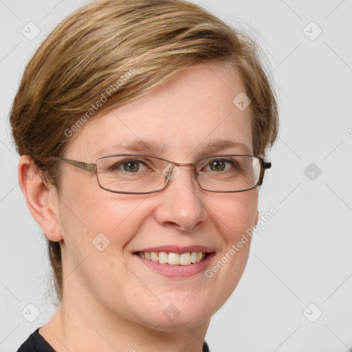 Joyful white adult female with medium  brown hair and blue eyes