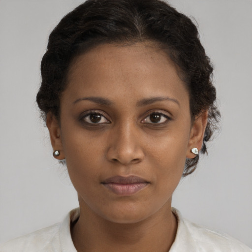 Neutral black young-adult female with short  brown hair and brown eyes