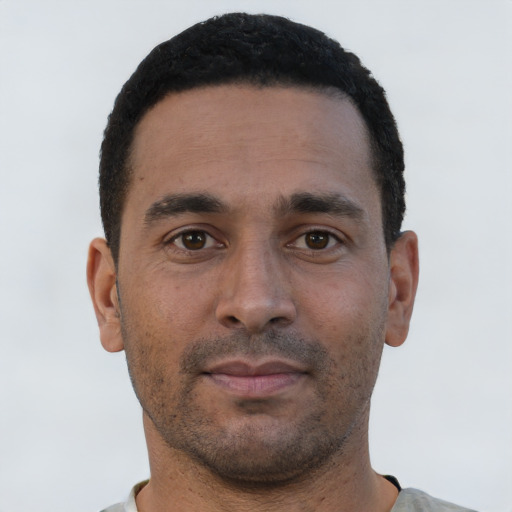 Neutral white young-adult male with short  black hair and brown eyes