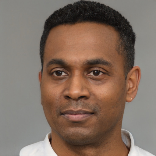 Neutral black young-adult male with short  black hair and brown eyes