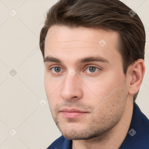 Neutral white young-adult male with short  brown hair and grey eyes