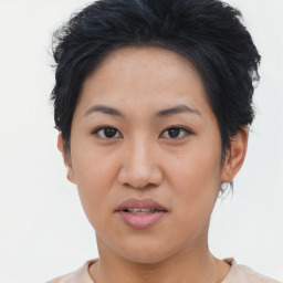 Joyful asian young-adult female with short  brown hair and brown eyes