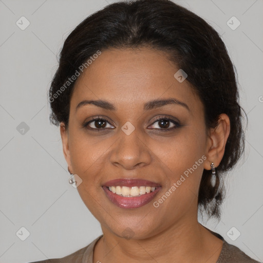 Joyful black young-adult female with medium  brown hair and brown eyes