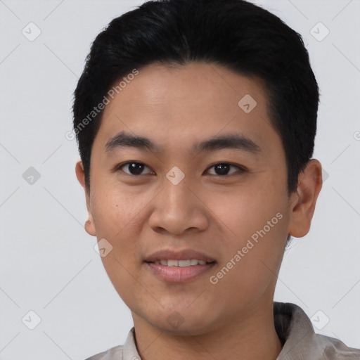 Joyful asian young-adult male with short  black hair and brown eyes