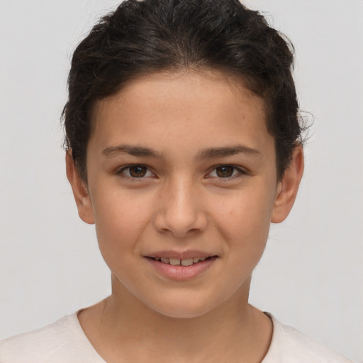 Joyful white child female with short  brown hair and brown eyes