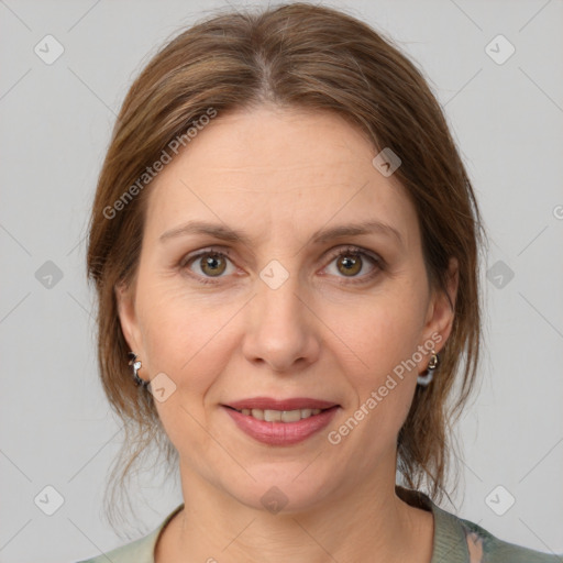 Joyful white adult female with medium  brown hair and grey eyes