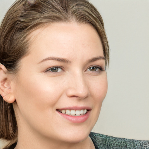 Joyful white young-adult female with medium  brown hair and blue eyes