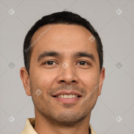 Joyful white young-adult male with short  black hair and brown eyes