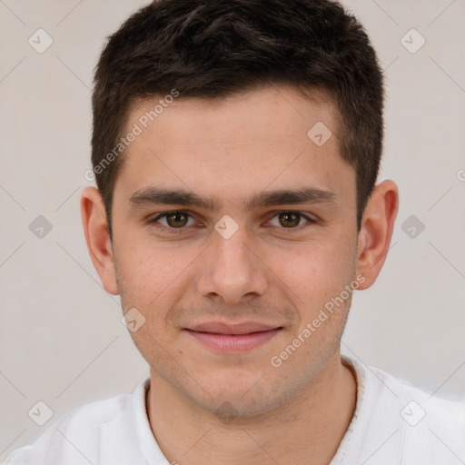 Joyful white young-adult male with short  brown hair and brown eyes