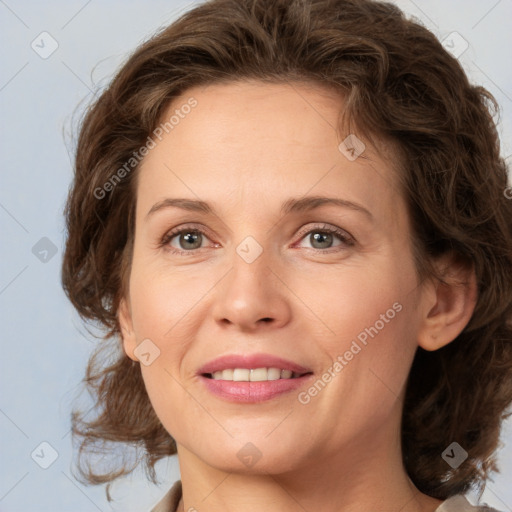 Joyful white young-adult female with medium  brown hair and green eyes