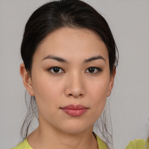 Neutral asian young-adult female with medium  brown hair and brown eyes