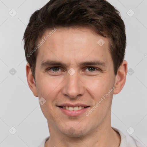 Joyful white adult male with short  brown hair and grey eyes