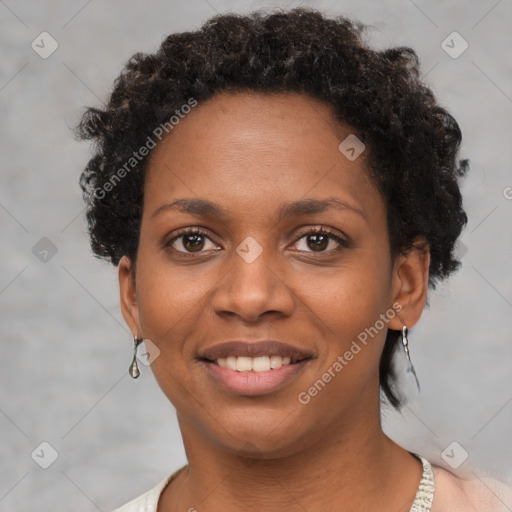 Joyful black young-adult female with short  brown hair and brown eyes