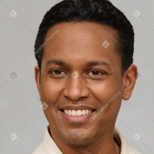 Joyful latino young-adult male with short  brown hair and brown eyes