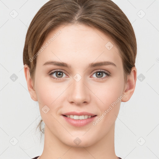 Joyful white young-adult female with medium  brown hair and grey eyes