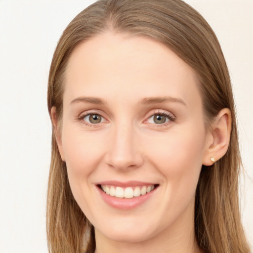 Joyful white young-adult female with long  brown hair and blue eyes