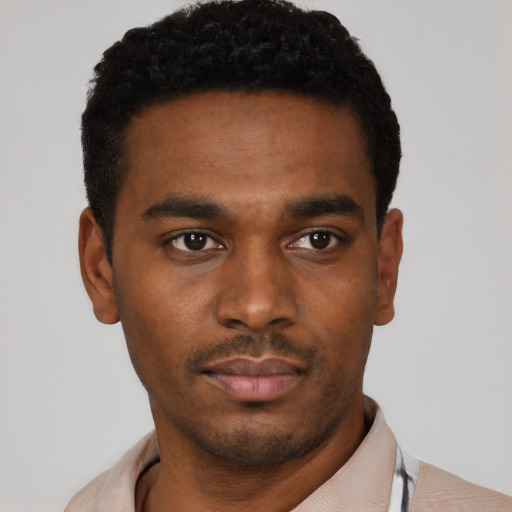 Neutral black young-adult male with short  black hair and brown eyes