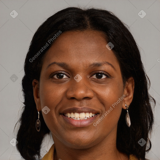 Joyful black young-adult female with medium  brown hair and brown eyes