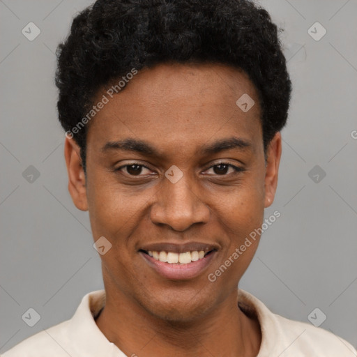 Joyful black young-adult male with short  black hair and brown eyes