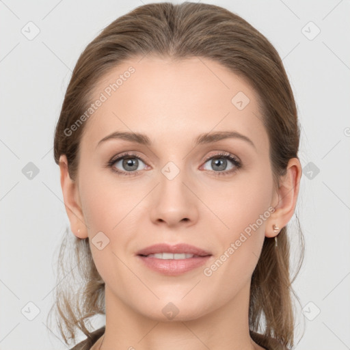 Joyful white young-adult female with medium  brown hair and grey eyes