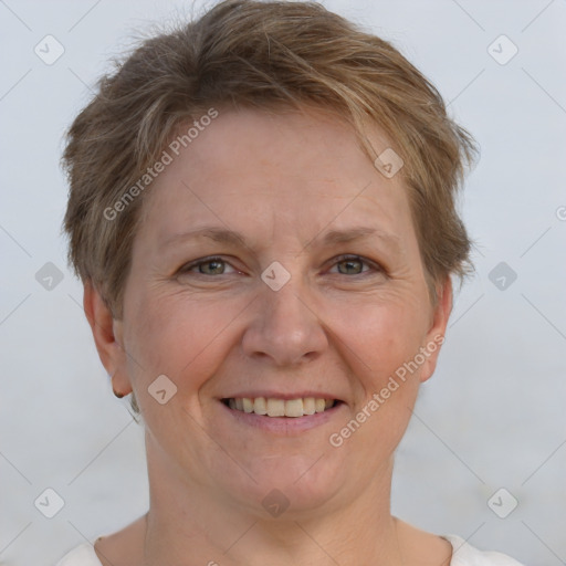 Joyful white adult female with short  brown hair and brown eyes