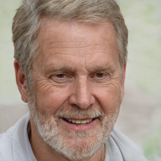 Joyful white middle-aged male with short  gray hair and brown eyes