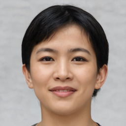 Joyful asian young-adult female with short  black hair and brown eyes