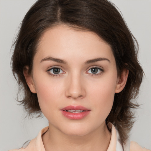 Neutral white young-adult female with medium  brown hair and brown eyes