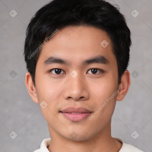 Joyful asian young-adult male with short  black hair and brown eyes